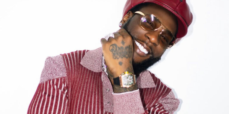 Burna Boy strolls on the runway to the white man at Paris Fashion Week